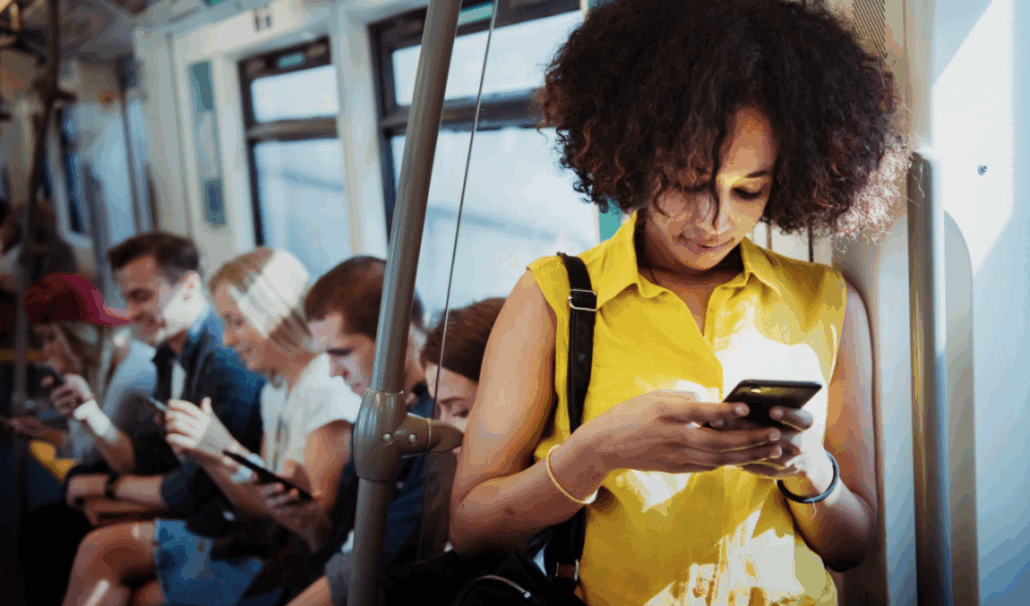 Woman using smartphone on subway